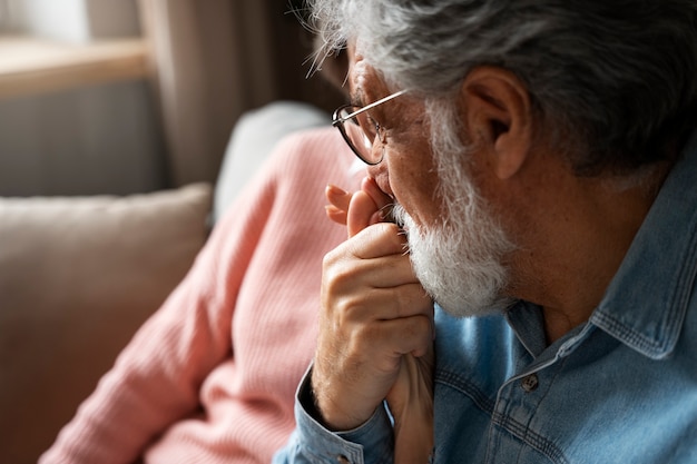 Senior People Sitting On Couch Side View