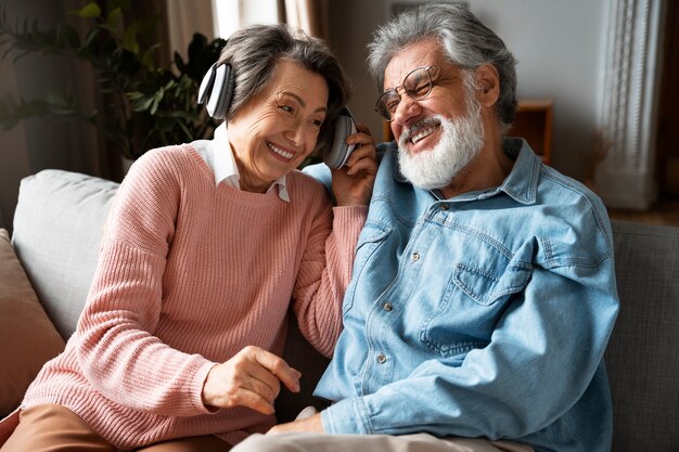 Senior people with headphones front view