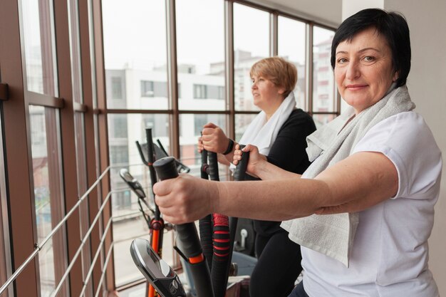 Senior smiley women on treadmill