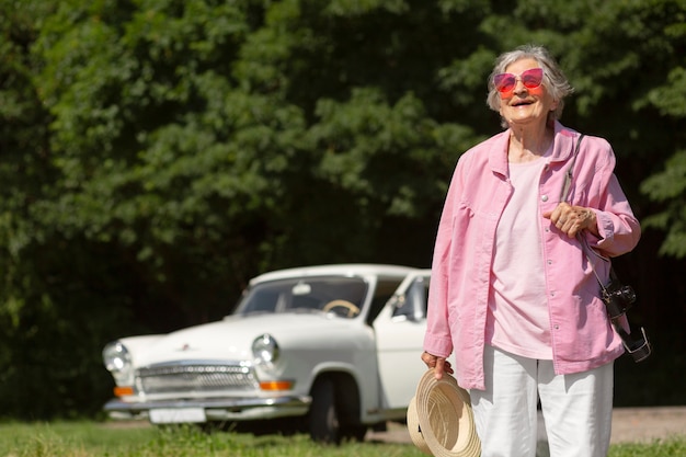 Senior traveler wearing red sunglasses