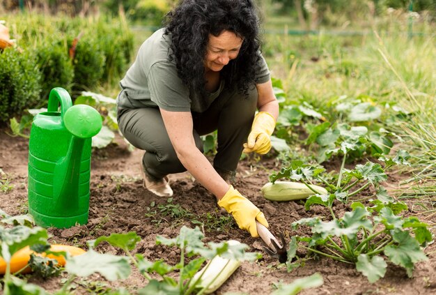 Senior woman caring the crops