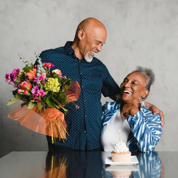 Senior woman celebrating her birthday with her husband Premium Photo