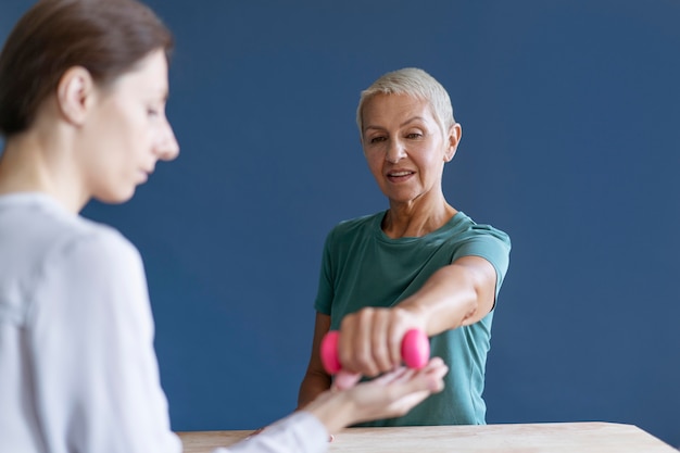 Senior woman doing an occupational therapy session with a psychologist