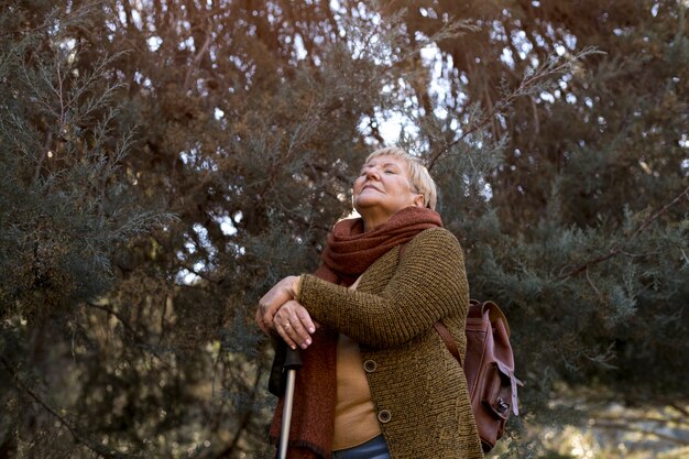 Senior woman enjoying a hike in nature