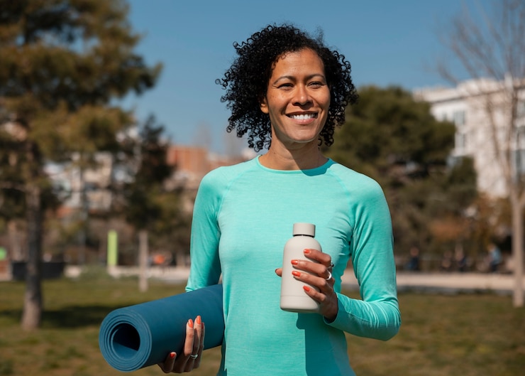 Free Photo senior woman exercising outdoors in the park