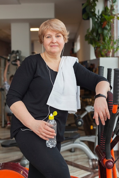 Senior woman at gym exercising