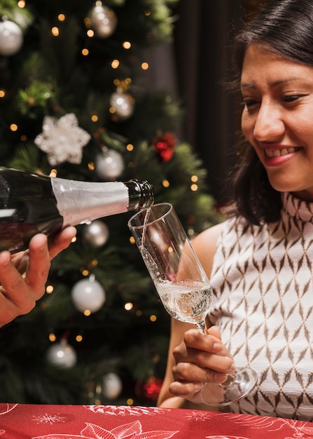 Senior woman holding champagne glass