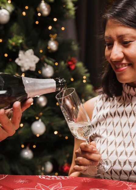 Senior woman holding champagne glass