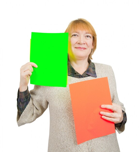 senior woman holding empty red and green posters.