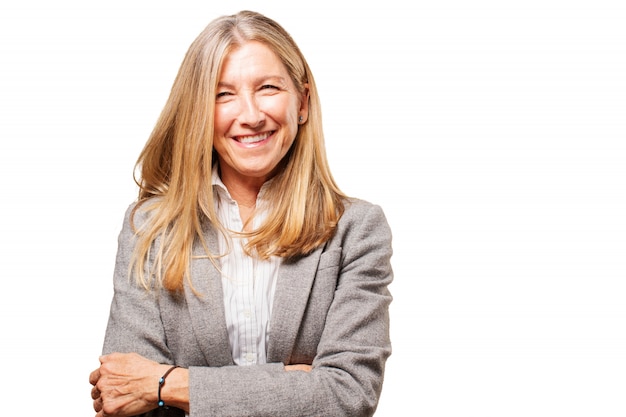 Senior woman laughing and with arms crossed