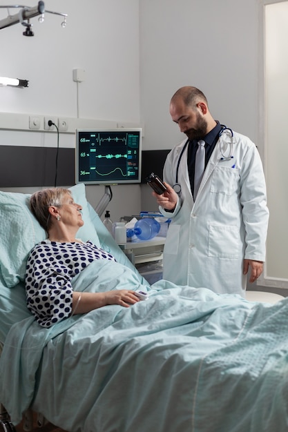 Senior woman patient breathing with help from oxygen tube