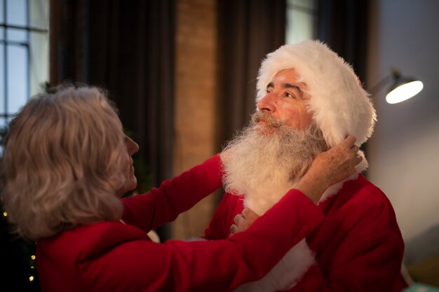 Senior woman setting up santa claus