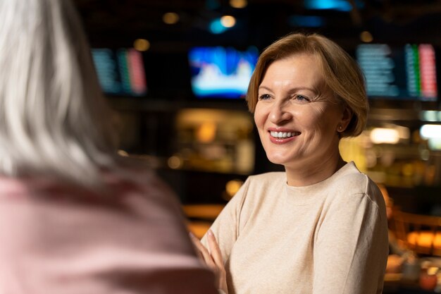 Senior woman smiling at a restaurant
