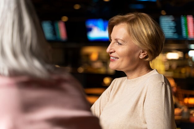 Senior woman smiling at a restaurant