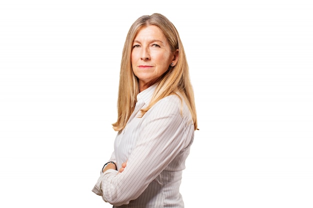 Free photo senior woman standing with arms crossed