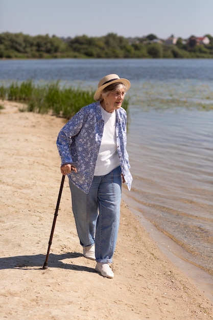 Free photo senior woman traveler in the summer