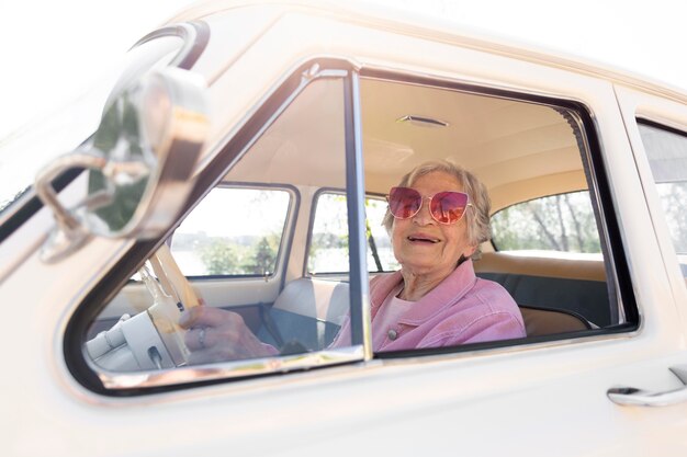 Senior woman traveling alone by car