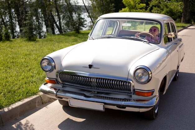 Senior woman traveling alone by car