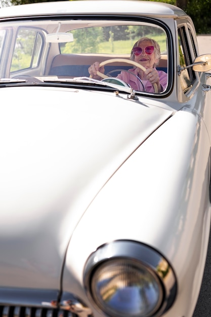 Senior woman traveling alone by car