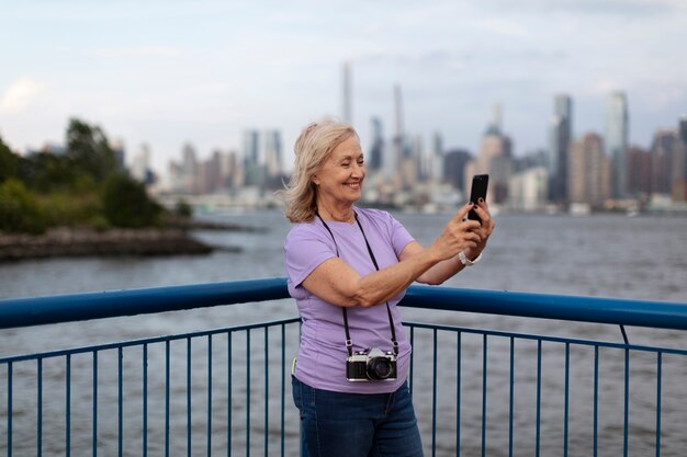 Senior woman traveling areound the world