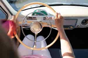 Free photo senior woman traveling by car in daytime