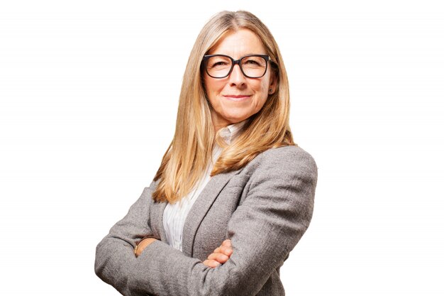 Senior woman with crossed arms and glasses to see