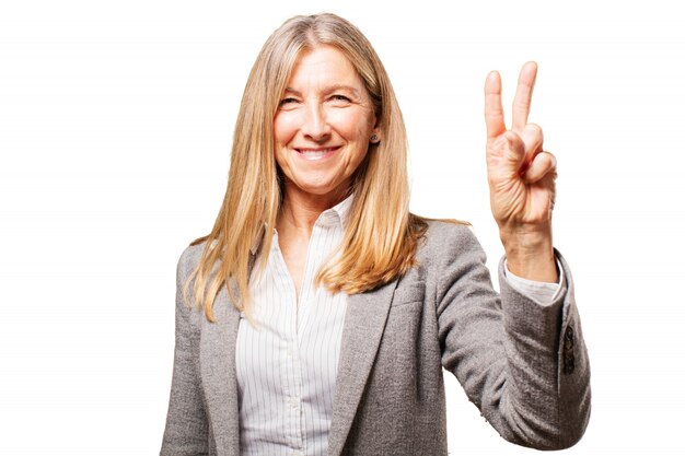 Senior woman with two raised fingers