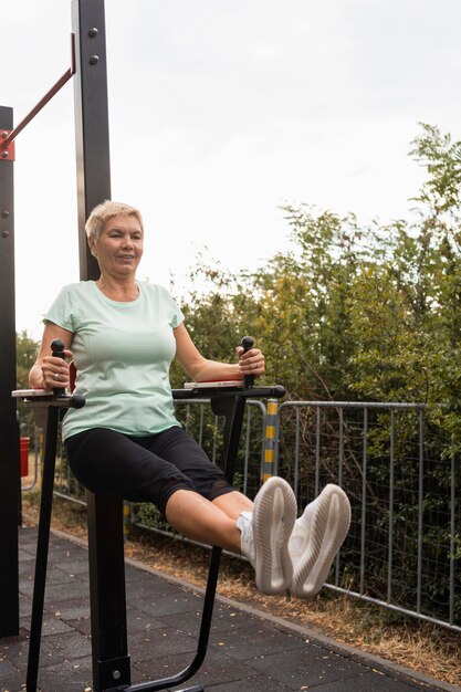 Senior woman working out outdoors