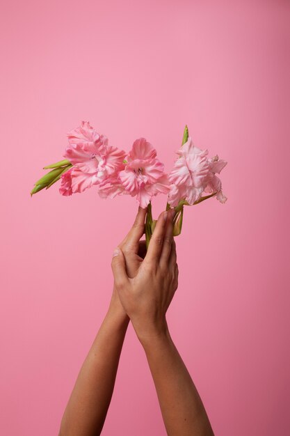 Sensitive hand with beautiful flower