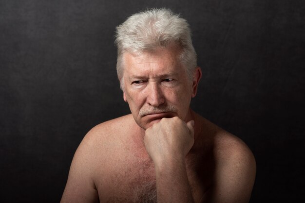 Sensitive old man portrait in studio