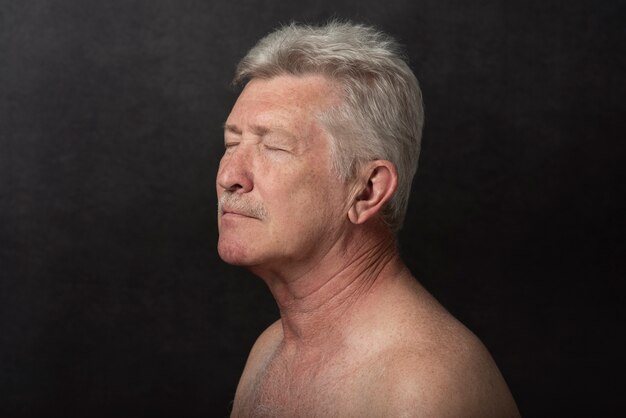 Sensitive old man portrait in studio