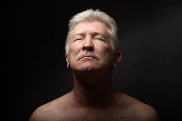 Sensitive old man portrait in studio