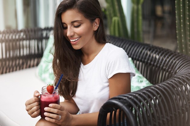 Sensual charming tanned european stylish woman in white t-shirt