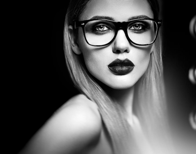 sensual glamour portrait of beautiful blond woman model  with fresh daily makeup with purple lips color and clean healthy skin in glasses. Black and white