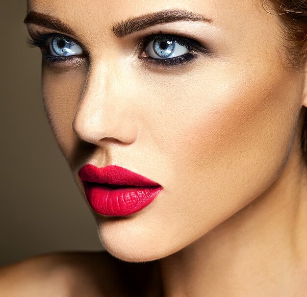 sensual glamour portrait of beautiful woman model lady with fresh daily makeup with red lips color and clean healthy skin face