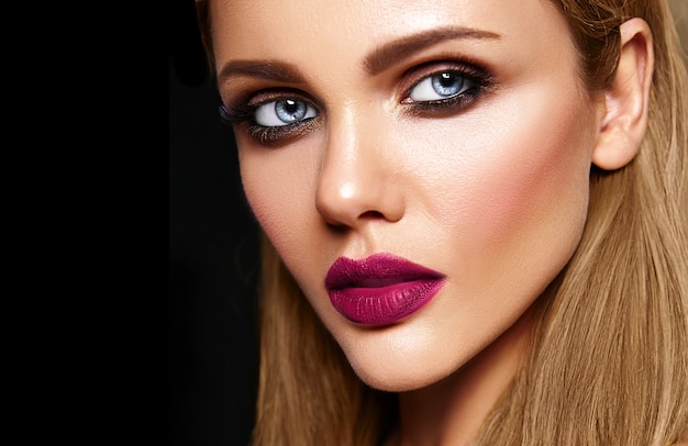 Sensual glamour portrait of beautiful woman model with fresh daily makeup with dark pink lips color and clean healthy skin face