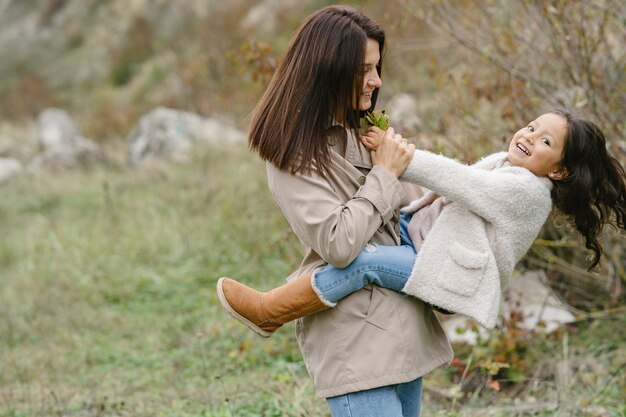 Sensual photo. Cute little girl. People walks outside