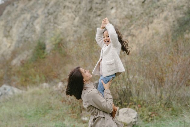 Sensual photo. Cute little girl. People walks outside