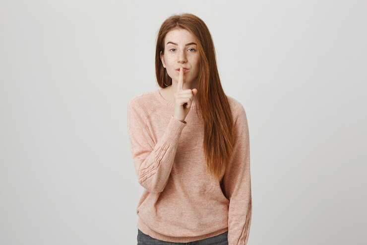 Free Photo sensual redhead girl shush, keeping secret
