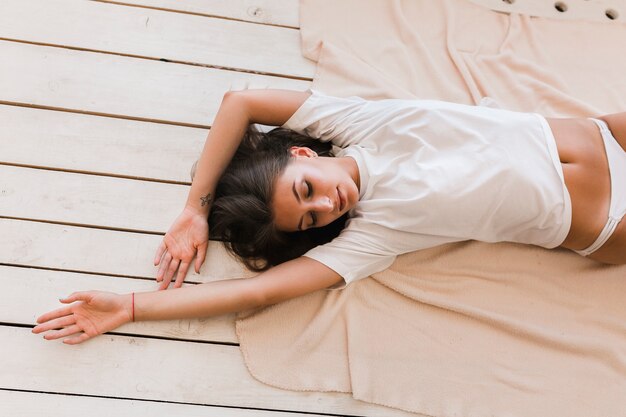 Sensual woman lying on blanket