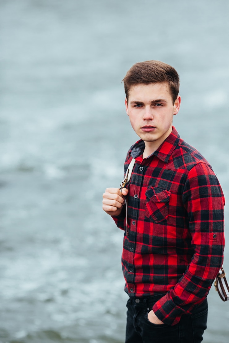 Free Photo serene boy posing with plaid shirt
