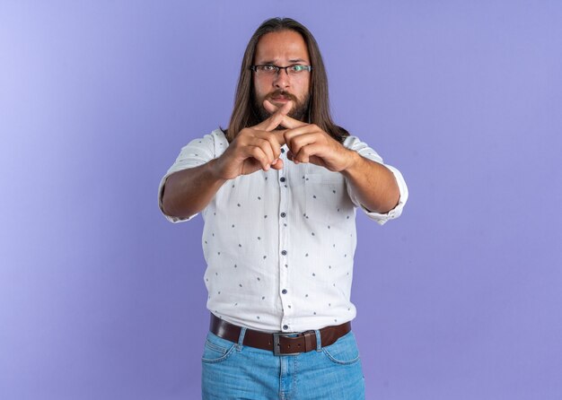 Serious adult handsome man wearing glasses doing no gesture 