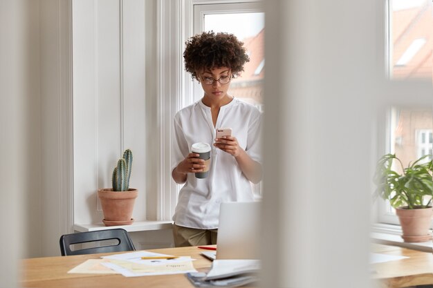 Serious attractive girl copywriter working at home