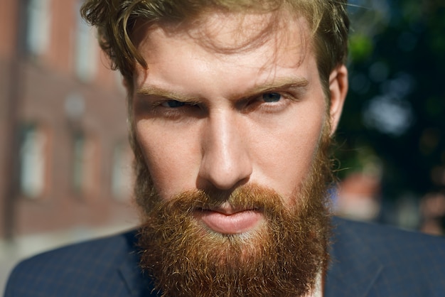 Serious bearded man outdoors