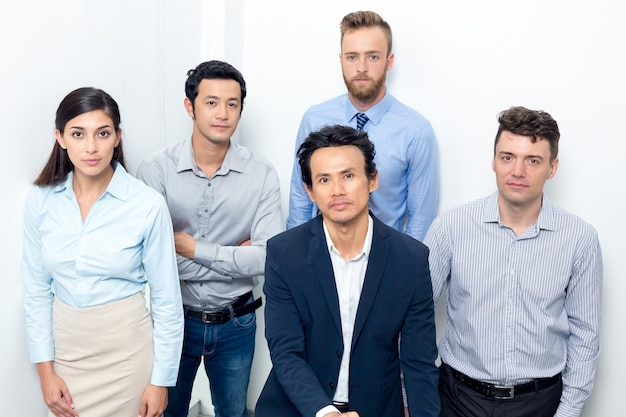 Serious Business Team Gathering on Office Stairway