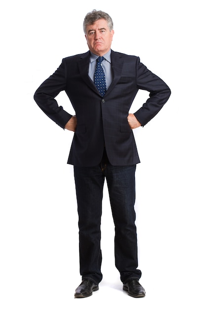 Serious businessman with hands on waist