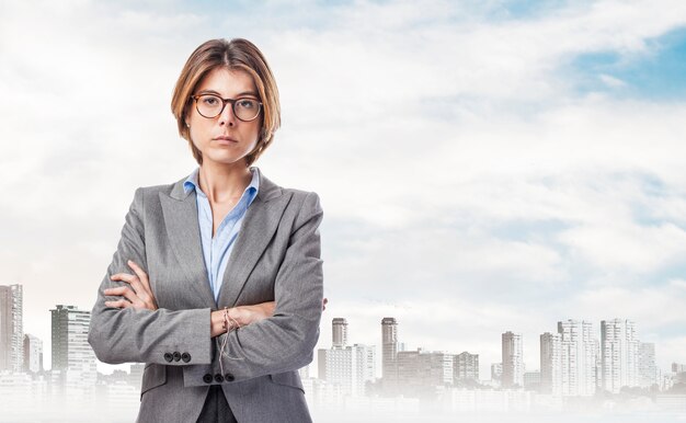 Serious businesswoman with the city in the distance