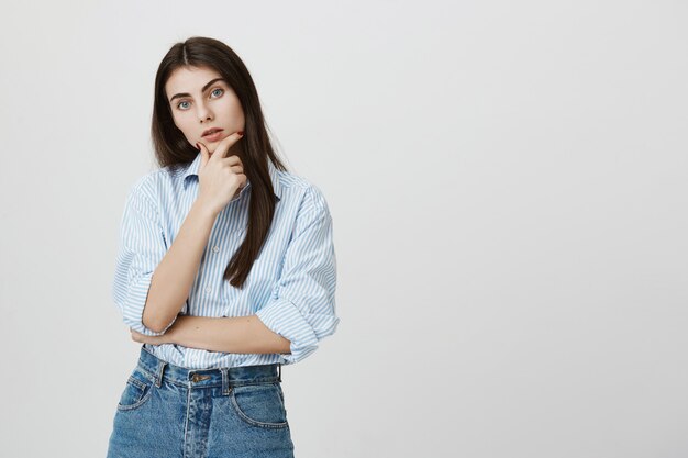 Serious concentrated woman making decision, thinking