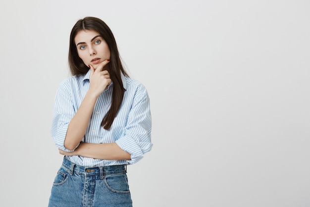 Serious concentrated woman making decision, thinking