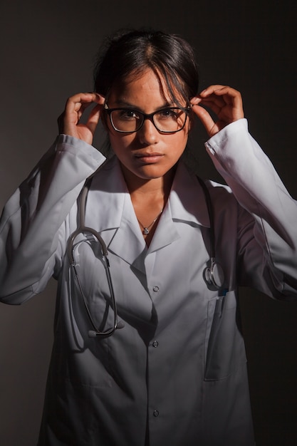 Serious doctor posing with glasses